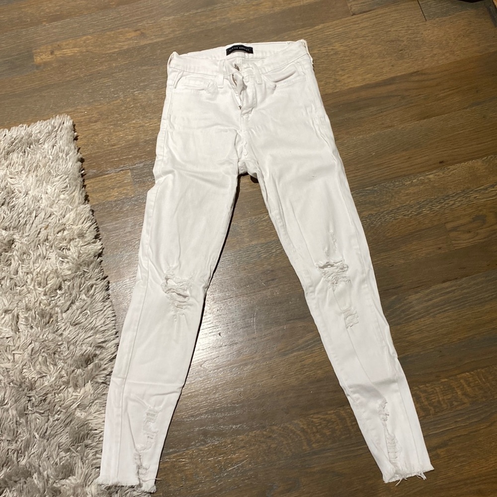 Skinny white flying monkey jeans with rips